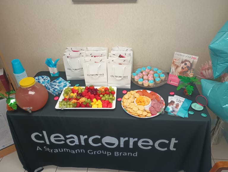 Clear correct display table with snacks and gift bags on it
